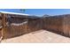 Backyard space featuring a tiled patio and a tall wooden privacy fence at 10951 N 91St Ave # 222, Peoria, AZ 85345