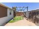 Backyard featuring artificial grass, a pergola, and sturdy fencing at 10951 N 91St Ave # 222, Peoria, AZ 85345
