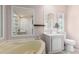 Bathroom featuring a soaking tub, vanity with sink, and a toilet at 10951 N 91St Ave # 222, Peoria, AZ 85345
