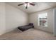 Cozy bedroom featuring a ceiling fan and a window that allows plenty of natural light in at 10951 N 91St Ave # 222, Peoria, AZ 85345