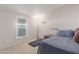 Bedroom featuring a window, personal treadmill, and a small bookcase at 10951 N 91St Ave # 222, Peoria, AZ 85345