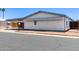 Charming single-story home with a covered carport and decorative rock landscaping at 10951 N 91St Ave # 222, Peoria, AZ 85345