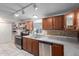 Traditional kitchen featuring stainless steel appliances, wooden cabinetry, and tile backsplash at 10951 N 91St Ave # 222, Peoria, AZ 85345