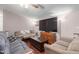Comfortable living room featuring plush seating and a large screen TV at 10951 N 91St Ave # 222, Peoria, AZ 85345
