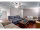 Cozy living room showcasing comfortable sofas and a ceiling fan at 10951 N 91St Ave # 222, Peoria, AZ 85345