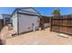 Backyard shed on a tiled patio, surrounded by a wooden fence for privacy at 10951 N 91St Ave # 222, Peoria, AZ 85345