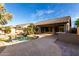 Inviting backyard featuring a private pool, lush palm trees, and ample patio space for outdoor enjoyment at 11402 W Hadley St, Avondale, AZ 85323
