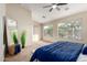 Sun-filled bedroom featuring large windows, plush carpet and stylish decor at 11402 W Hadley St, Avondale, AZ 85323