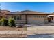 A charming single-story home with a well-manicured front yard and a convenient two-car garage at 11402 W Hadley St, Avondale, AZ 85323