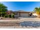 Charming single-story home with a well-maintained front yard and two-car garage at 11402 W Hadley St, Avondale, AZ 85323