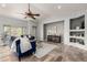 Bright living room with vaulted ceilings, wood-look floors, and stylish blue furniture at 11402 W Hadley St, Avondale, AZ 85323
