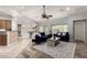 Spacious living room with an open layout, connecting to the dining area and kitchen at 11402 W Hadley St, Avondale, AZ 85323