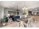 Open living space features a dining area, living room, and breakfast bar at 11402 W Hadley St, Avondale, AZ 85323