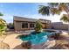 Serene backyard pool surrounded by desert landscaping, offering a private oasis for relaxation and recreation at 11402 W Hadley St, Avondale, AZ 85323