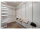 Spacious walk-in closet featuring white shelving, and carpet floors at 11402 W Hadley St, Avondale, AZ 85323