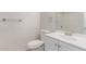 This bright bathroom includes a single sink vanity, toilet and towel rack at 11538 W Windrose Ave, El Mirage, AZ 85335