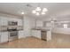Well-appointed kitchen boasts granite countertops, stainless steel appliances, and white cabinetry at 11538 W Windrose Ave, El Mirage, AZ 85335