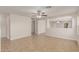 Bright living room features tile floors, and view into other living spaces for seamless entertaining at 11538 W Windrose Ave, El Mirage, AZ 85335