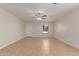 Bright, open living area features neutral paint, tile flooring, and ample natural light at 11538 W Windrose Ave, El Mirage, AZ 85335