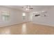 Bright living room features tile floors, two windows, and view into the kitchen for seamless entertaining at 11538 W Windrose Ave, El Mirage, AZ 85335