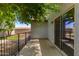 Covered patio with door leading into the home at 11538 W Windrose Ave, El Mirage, AZ 85335