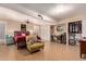 Spacious basement bedroom with tile flooring, closet, chair, and ample storage at 12423 N 64Th St, Scottsdale, AZ 85254