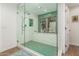 Beautiful bathroom with a tub, shower with green mosaic tiles and modern fixtures at 12423 N 64Th St, Scottsdale, AZ 85254