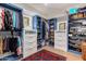 Spacious walk-in closet with custom blue shelving and ample storage space at 12423 N 64Th St, Scottsdale, AZ 85254