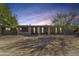 Charming single-story home with stone accents, desert landscaping, and walkway leading to the front entrance at 12423 N 64Th St, Scottsdale, AZ 85254