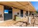 Covered horse stalls with brick flooring, hay, and open windows for ventilation at 12423 N 64Th St, Scottsdale, AZ 85254