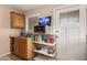 Functional kitchen area with sink, cabinets, and appliances, enhanced by a window for natural light at 12423 N 64Th St, Scottsdale, AZ 85254