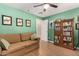 Cozy living room with a comfortable sofa, bookshelf and lots of natural light at 12423 N 64Th St, Scottsdale, AZ 85254