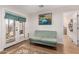 Cozy sitting area features a comfortable sofa and access to outdoor area at 12423 N 64Th St, Scottsdale, AZ 85254