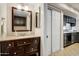 Stylish bathroom featuring a vanity with granite countertop and dark wood cabinets, complemented by modern fixtures at 1342 W Emerald Ave # 286, Mesa, AZ 85202