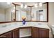Bathroom with a double sink vanity, dark wood cabinets, and a large mirror, providing ample space at 1342 W Emerald Ave # 286, Mesa, AZ 85202