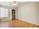 Bright bedroom with hardwood floors, an open closet, natural light from a window, and neutral paint at 1342 W Emerald Ave # 286, Mesa, AZ 85202