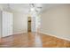 Bright bedroom with hardwood floors, an open closet, natural light from a window, and neutral paint at 1342 W Emerald Ave # 286, Mesa, AZ 85202