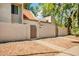Charming home with a red tile roof, gated entry, and neutral-toned stucco walls surrounded by gravel landscaping at 1342 W Emerald Ave # 286, Mesa, AZ 85202