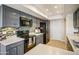Updated kitchen features sleek black appliances, light countertops, and stylish backsplash for a modern cooking experience at 1342 W Emerald Ave # 286, Mesa, AZ 85202