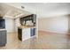 Open concept kitchen featuring tile floors, black appliances and barstool seating perfect for entertaining at 1342 W Emerald Ave # 286, Mesa, AZ 85202