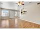 Bright living space with hardwood floors and natural light, featuring large windows that overlook the front yard at 1342 W Emerald Ave # 286, Mesa, AZ 85202