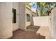 Enclosed patio featuring a brick-paved surface, providing a private outdoor space with views of the home's exterior at 1342 W Emerald Ave # 286, Mesa, AZ 85202