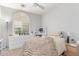 Cozy bedroom with lots of natural light from the large window and a comfortable bed at 1547 W Lacewood W Pl, Phoenix, AZ 85045