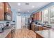 This kitchen features stainless steel appliances, wooden cabinets, and hardwood floors at 1547 W Lacewood W Pl, Phoenix, AZ 85045