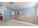 A spacious loft with natural light and wooden railing at 1547 W Lacewood W Pl, Phoenix, AZ 85045