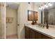 Granite counters and warm wood cabinets accent this neutral toned bathroom at 16233 E Rosetta Dr # 47, Fountain Hills, AZ 85268