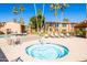 Community hot tub with lounge chairs and a clear blue sky background at 16233 E Rosetta Dr # 47, Fountain Hills, AZ 85268