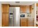 Well-lit kitchen featuring stainless steel appliances and wood cabinetry at 16233 E Rosetta Dr # 47, Fountain Hills, AZ 85268