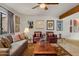 Cozy living room featuring a comfortable sofa, elegant armchairs, and stylish decor for relaxation and entertainment at 16233 E Rosetta Dr # 47, Fountain Hills, AZ 85268