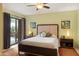 Cozy main bedroom with ceiling fan, outdoor access and desert views at 16233 E Rosetta Dr # 47, Fountain Hills, AZ 85268